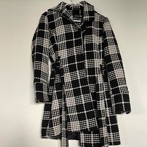 Black and white patterned coat.